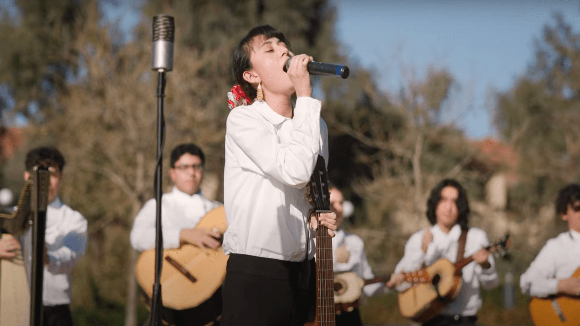 Young Mariachi lady singing at Stanford University's Meyer Green